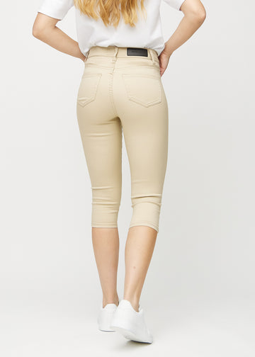 Beige skinny Capris von hinten gesehen, sodass man das ganze Produkt sehen kann.